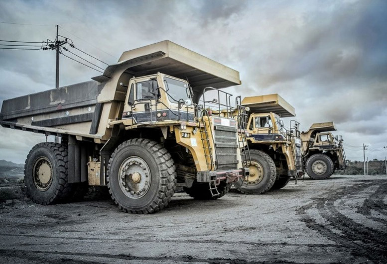 Heavy mining haul trucks at an earthmoving operation